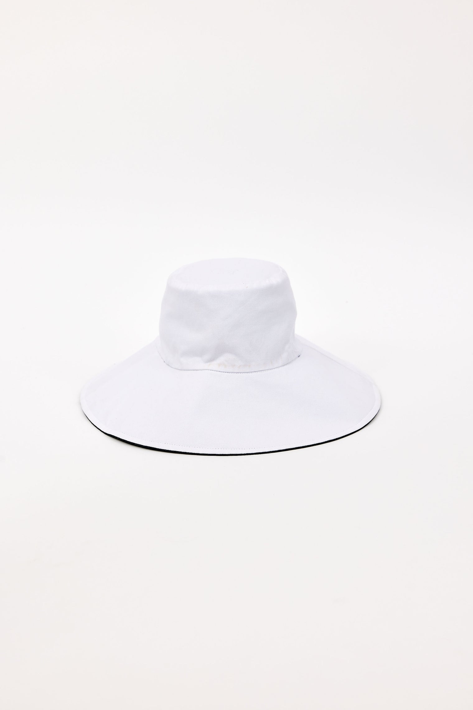 White wide-brimmed bucket hat on a white background