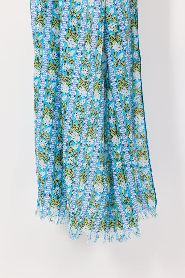 Floral patterned scarf with blue and green colors on a white background