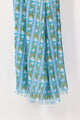 Floral patterned scarf with blue and green colors on a white background
