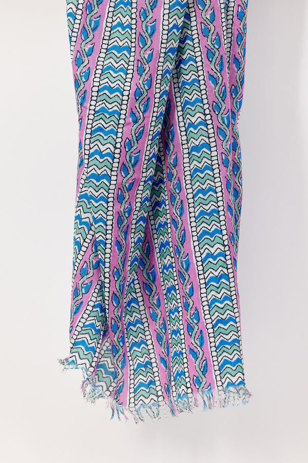 Colorful patterned scarf with blue, pink, and green design on a white background