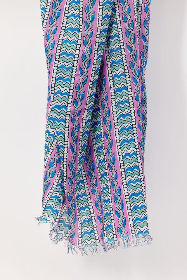 Colorful patterned scarf with blue, pink, and green design on a white background