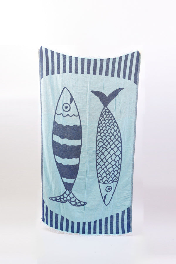 Towel with fish design on a light blue background