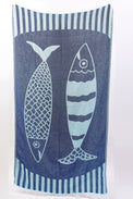 Towel with fish design and striped border on a white background