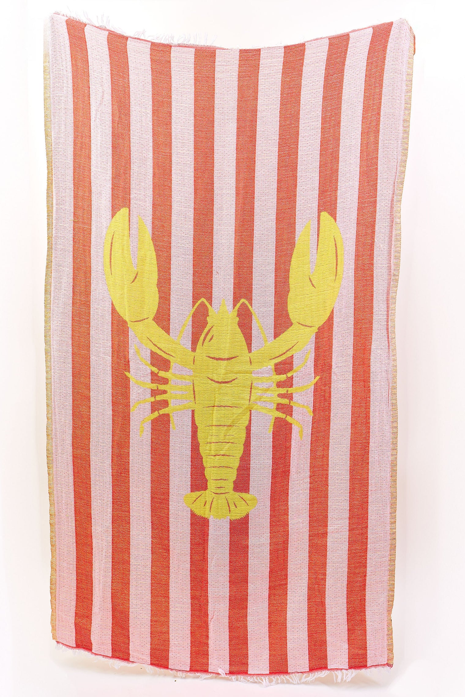 Striped towel with a yellow lobster design on a white background