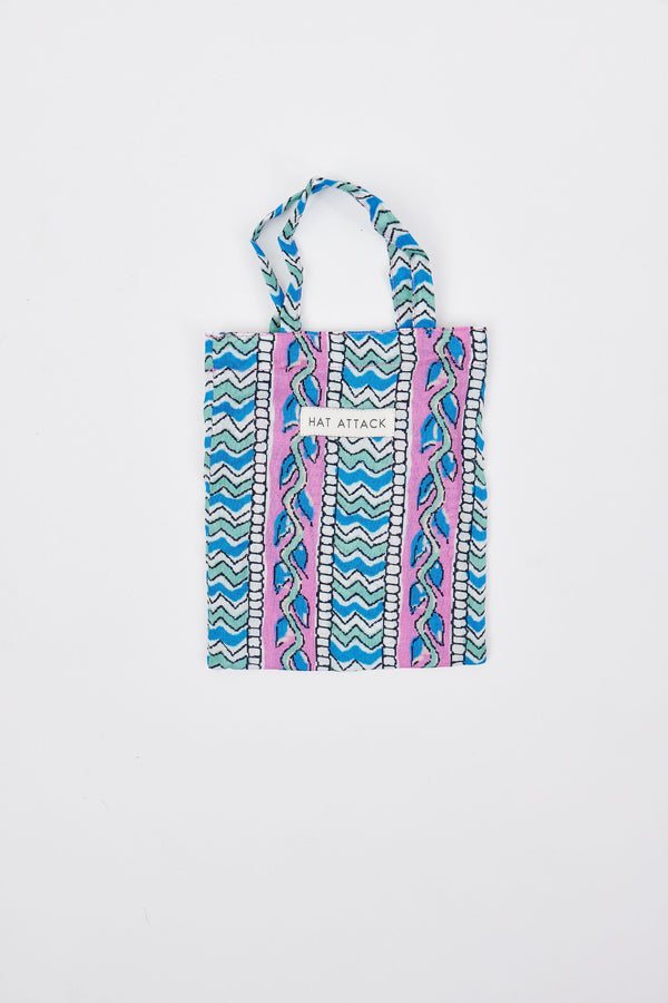 Colorful patterned mini bag with 'Hat Attack' branding on a white background