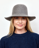 Grey velour brimmed hat on model