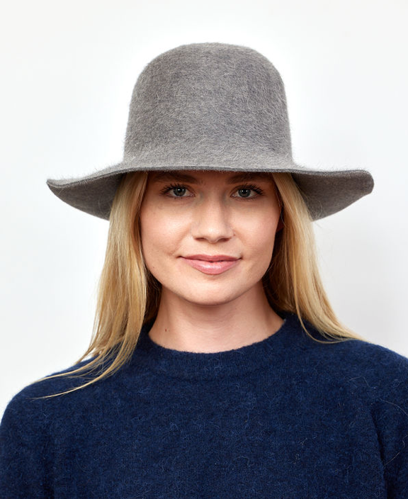 Model wearing grey velour brimmed hat