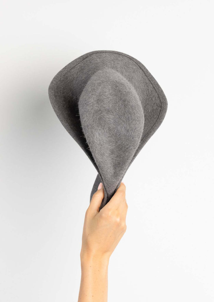 Chell Fedora in grey folded in hand