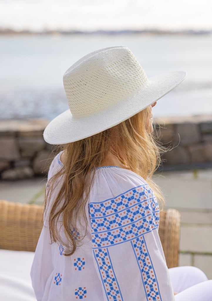 Perforated and Vented Packable hat in bleach on model at beach