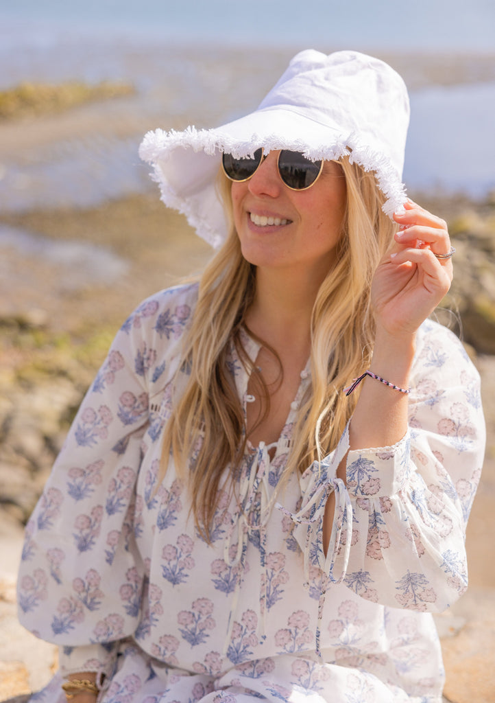 Canvas Packable bucket hat in white on woman in sunglasses