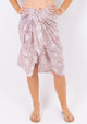 Tan floral sarong on model
