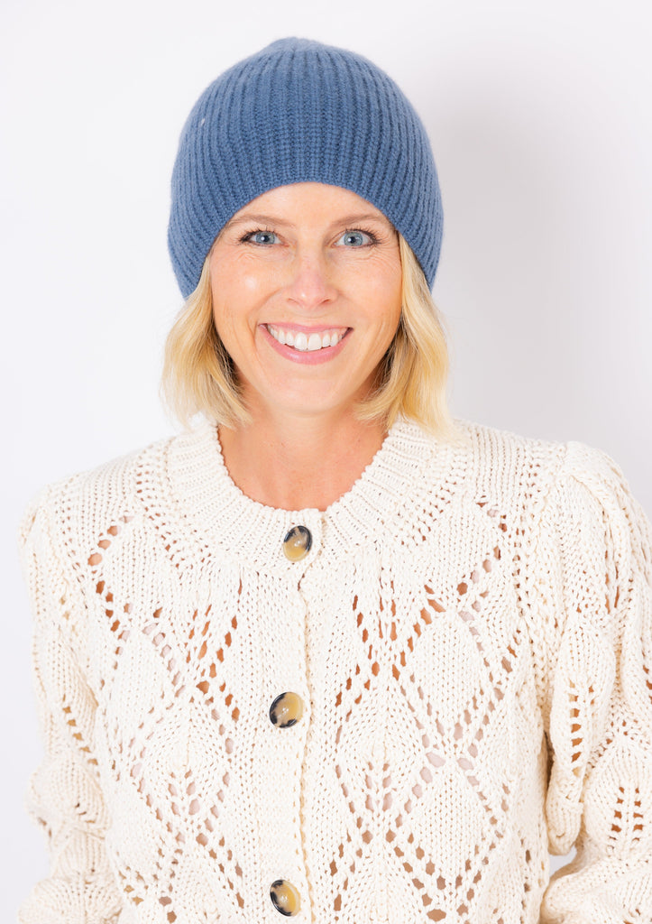 Cashmere Chunky Beanie in denim on model wearing ivory sweater