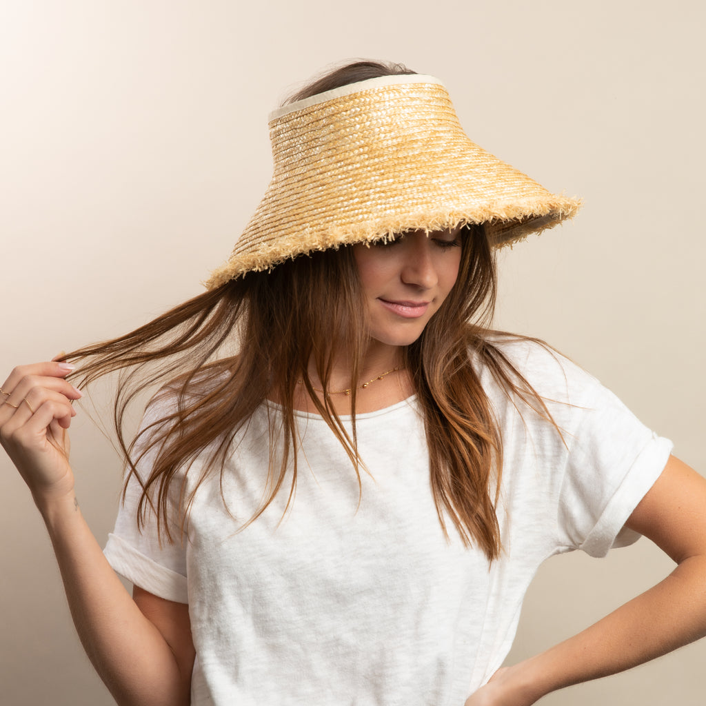 Wheat straw visor on model in white tee