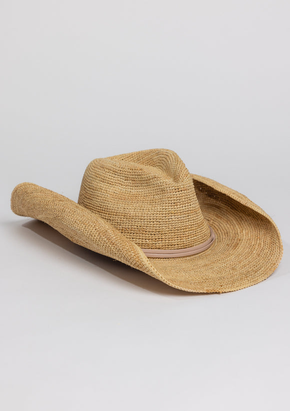 3/4 angle of raffia straw cowboy hat with tan wrap detail