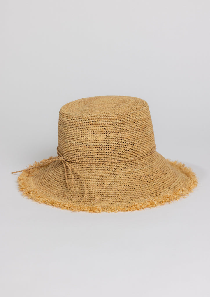 Natural colored Packable Raffia Bucket Hat with fringe trim and tie detail at band