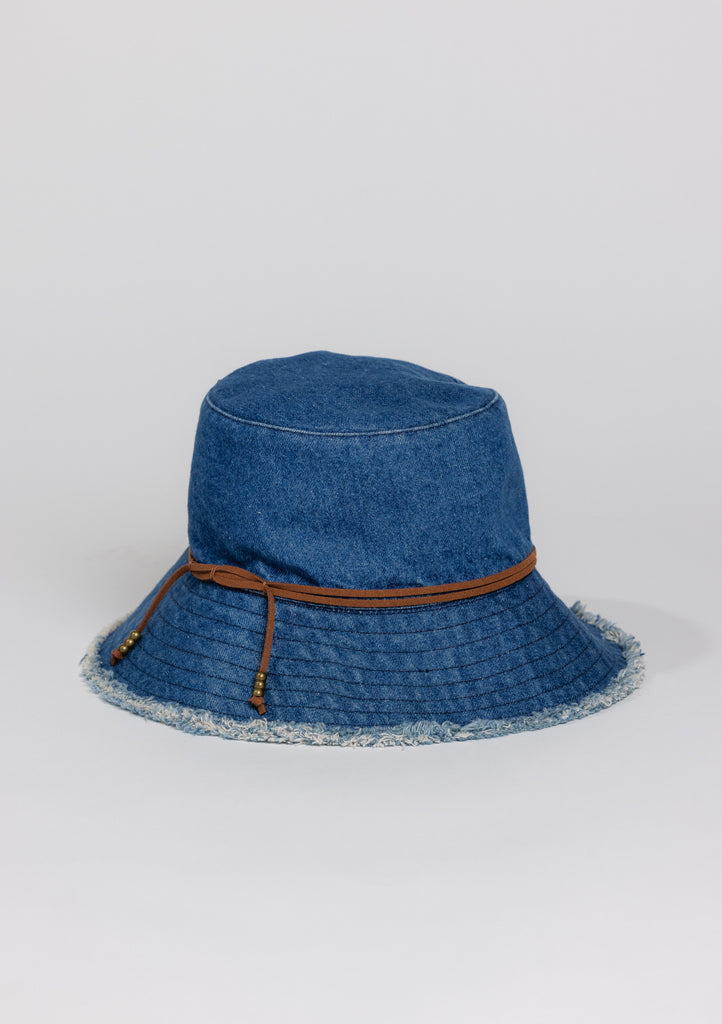 3/4 angle of Denim fringed bucket hat