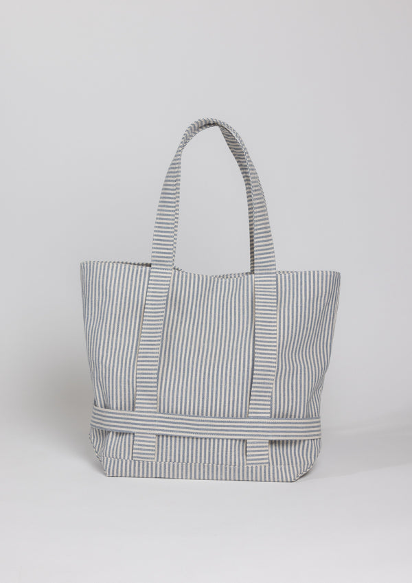Navy stripe canvas bag with straps to hold a hat