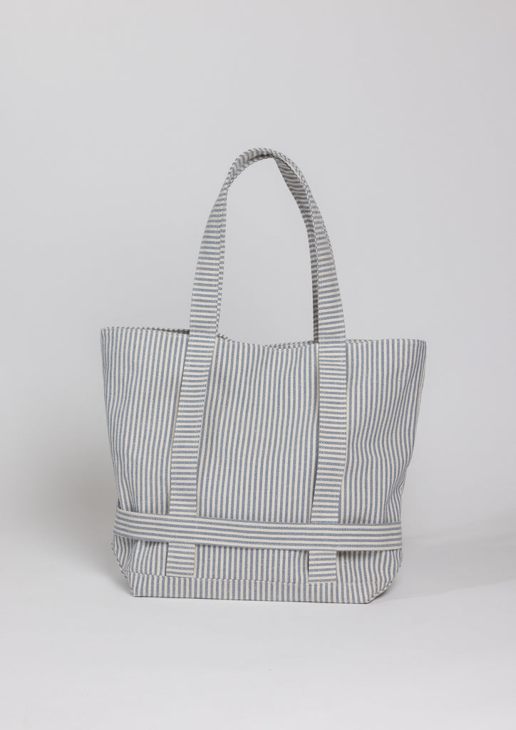 Navy stripe canvas bag with straps to hold a hat