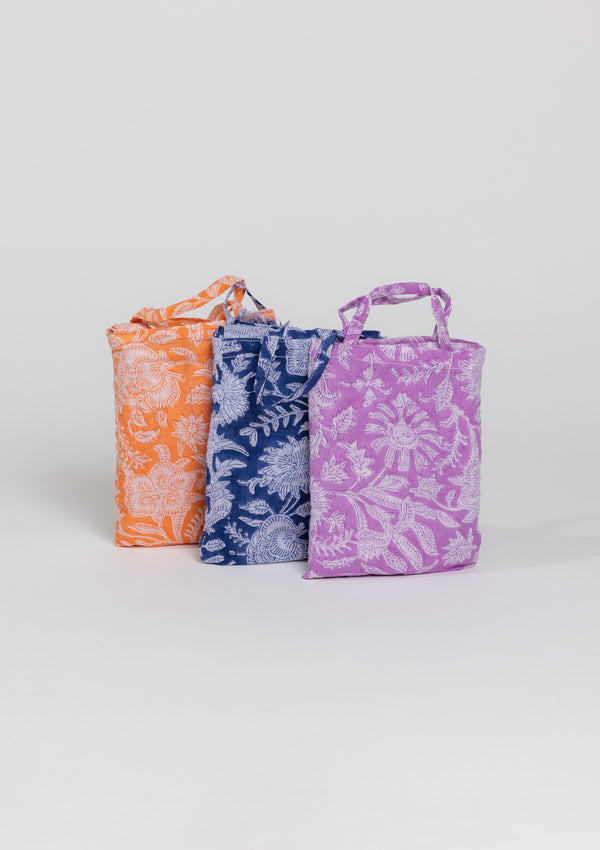 Blue, lavender and coral sarongs in mini bags